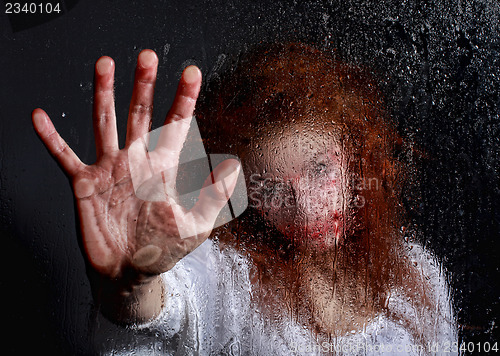 Image of Horror Themed Image With Bleeding Freightened Woman