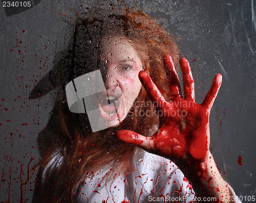 Image of Horror Themed Image With Bleeding Freightened Woman