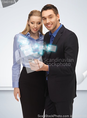 Image of man and woman with smartphone