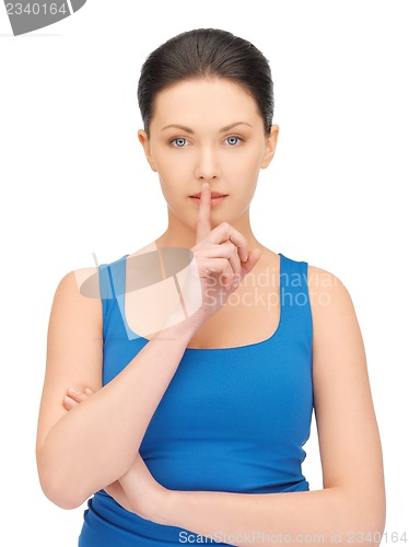Image of woman making a hush gesture
