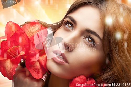 Image of lovely woman with red flowers