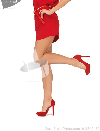 Image of picture of woman in red dress on high heels