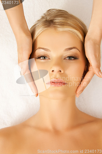 Image of beautiful woman in massage salon