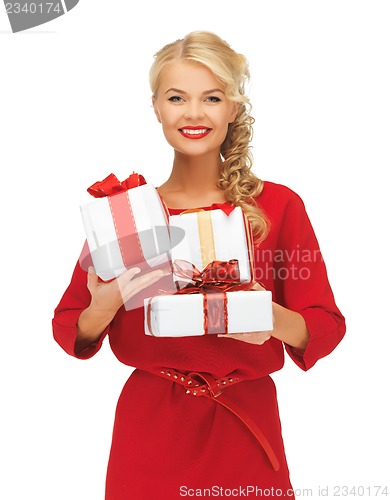 Image of lovely woman in red dress with gift boxes