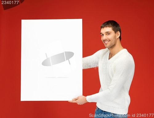 Image of handsome man with big blank board