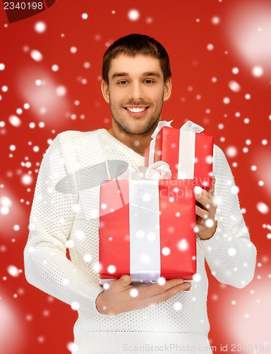 Image of man holding many gift boxes