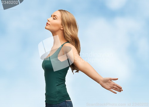 Image of woman spreading hands