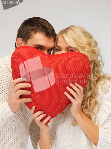 Image of family couple in a sweaters with heart