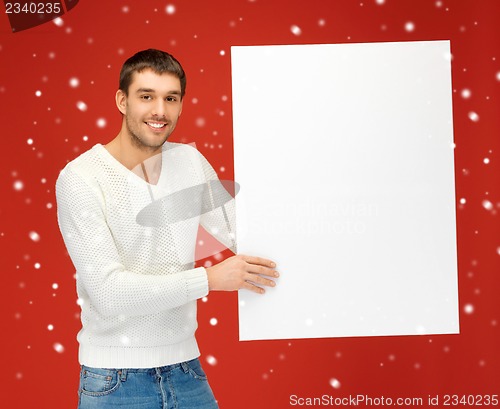 Image of handsome man with big blank board