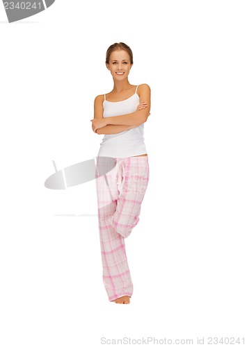 Image of happy and smiling woman in cotton pajamas