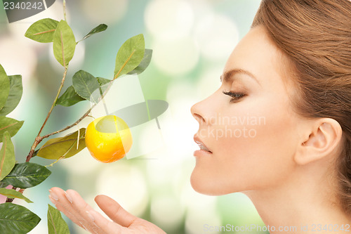 Image of lovely woman with lemon twig