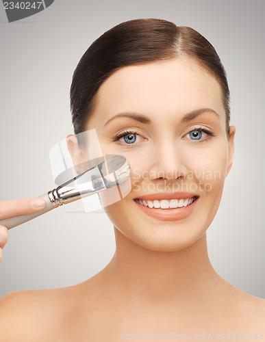 Image of beautiful woman with brush