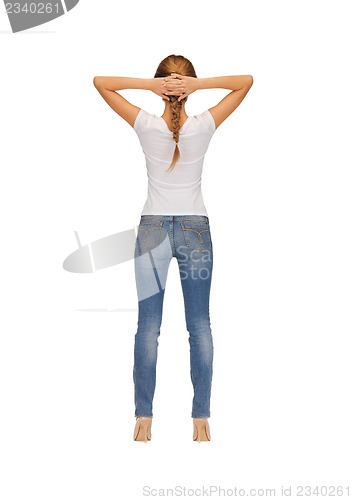 Image of rear view of woman in blank white t-shirt