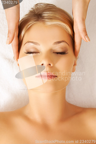 Image of beautiful woman in massage salon