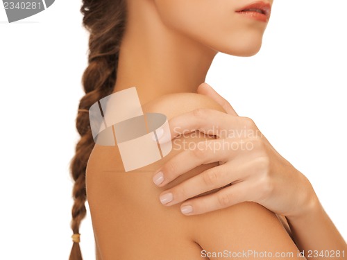 Image of woman's hand and shoulder