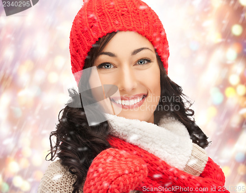 Image of beautiful woman in hat, muffler and mittens