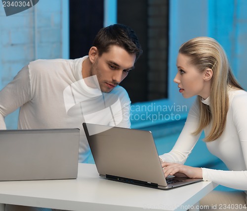 Image of man and woman in laboratory