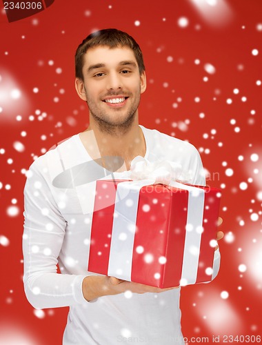 Image of handsome man with a gift