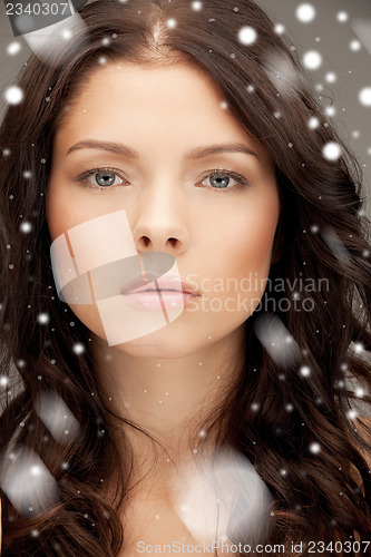 Image of beautiful woman with snow