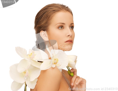 Image of lovely woman with orchid flower