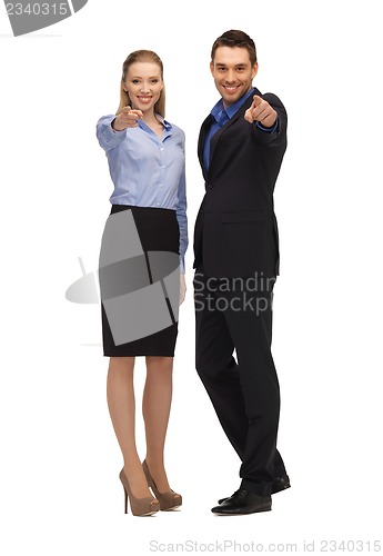 Image of man and woman pointing their fingers