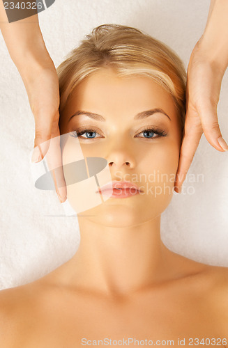 Image of beautiful woman in massage salon