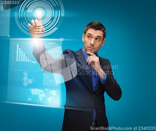 Image of man in suit working with virtual screens