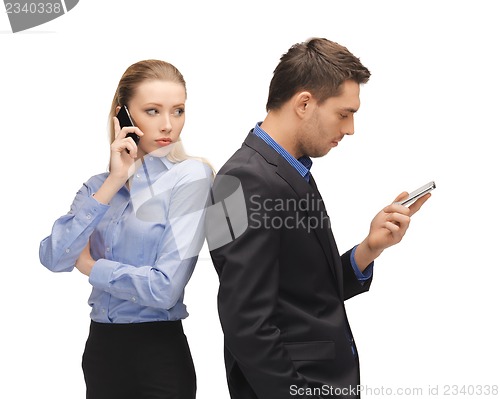 Image of man and woman with cell phones