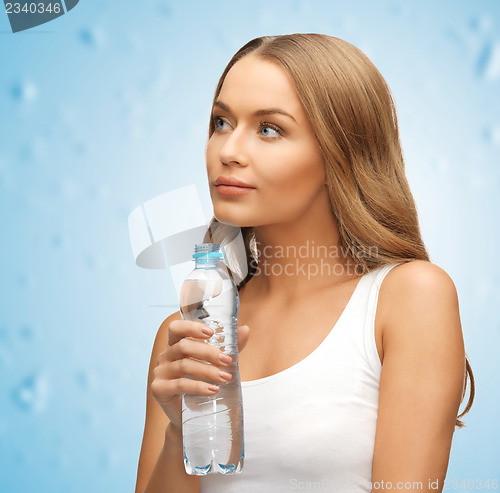 Image of young beautiful woman with  bottle of water