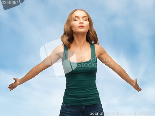 Image of woman spreading hands