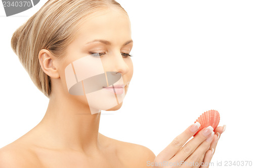 Image of beautiful woman with seashell