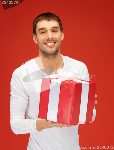 Image of handsome man with a gift