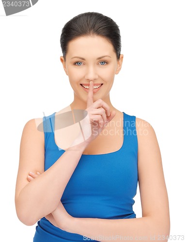 Image of woman making a hush gesture