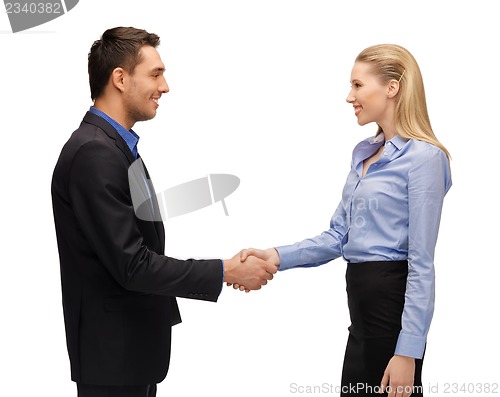 Image of man and woman shaking their hands