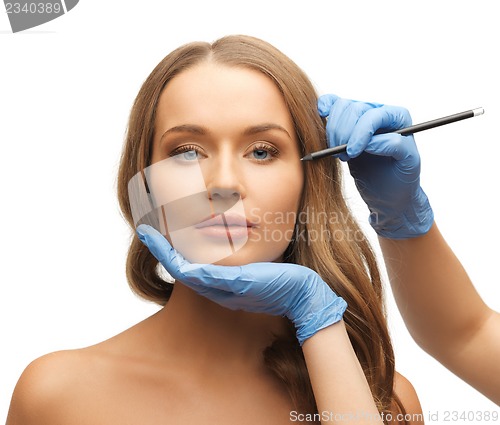 Image of woman face and beautician hands