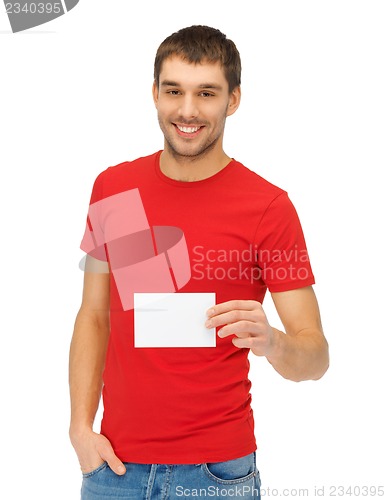 Image of handsome man with note card