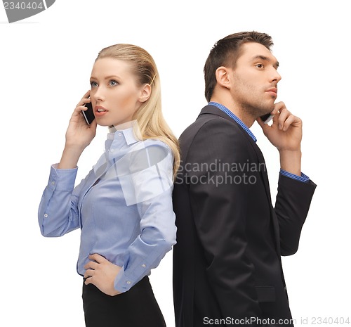 Image of man and woman with cell phones