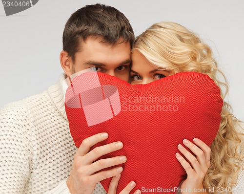 Image of family couple in a sweaters with heart