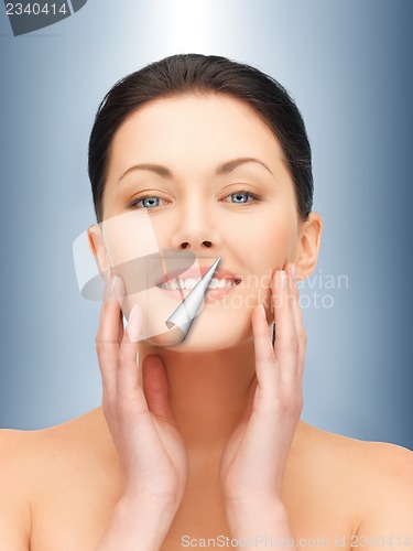 Image of face and hands of beautiful woman