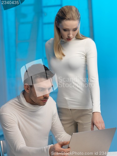 Image of man and woman in laboratory
