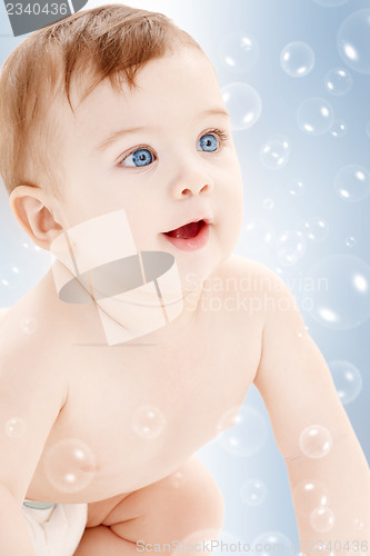 Image of crawling baby boy looking up