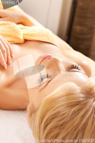 Image of beautiful woman in spa salon