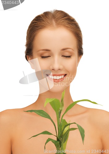 Image of woman with green sprout