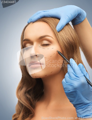 Image of woman face and beautician hands