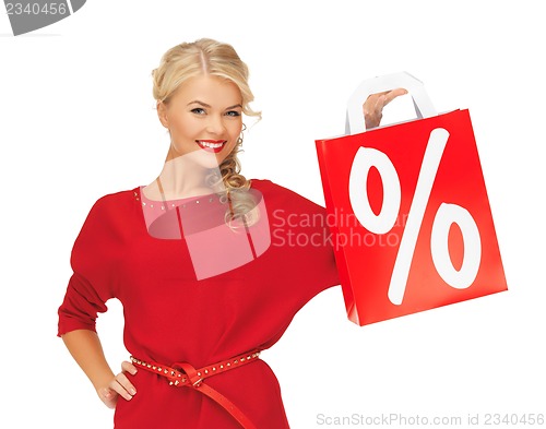 Image of beautiful woman in red dress with shopping bag