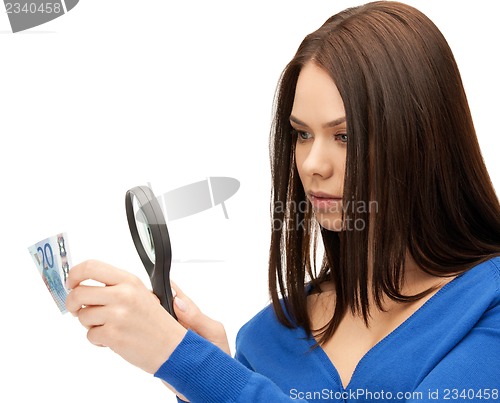 Image of woman with magnifying glass and euro cash money