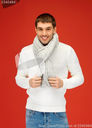 Image of handsome man in warm sweater and scarf