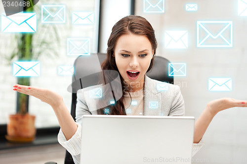 Image of happy woman with laptop computer