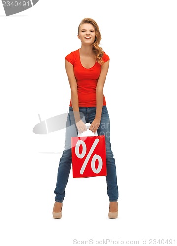 Image of teenage girl in red t-shirt with shopping bag