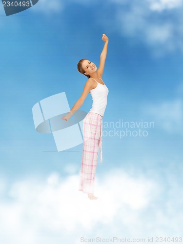 Image of woman in pajamas doing morning exercise